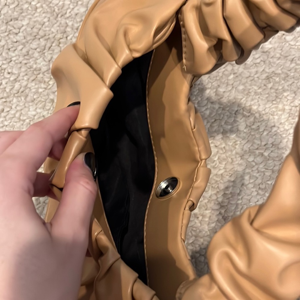 A mini tan trendy purse